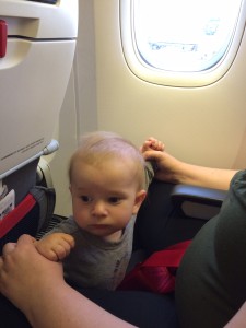 Plane baby wants his own seat.